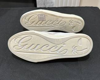 C119 - $125. Size 34.5. Gucci Slip On White Leather Sneakers. Shows minimal wear. 