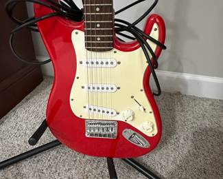 C15 - $100. Squier Mini by Fender with Stand. 