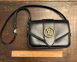 C106 - $1600. Louis Vuitton Pont 9 Black. Purchased by my client at the LV Store in LA. Certificate of Authenticity provided from Real Authentication. Only used a couple times. Overall in *very* good condition. There is a 1" scuff in the leather on the back - that is the only issue noted. Strap is adjustable. Gold accents are in very good condition. Gorgeous bag!