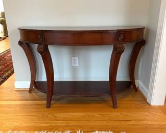C29 - $75. Demi Lune Entry Table. Measures 52" wide x 18" deep x 30.5" tall. 