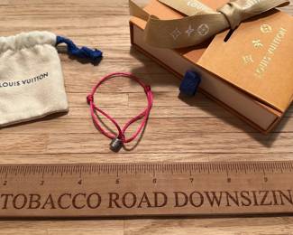 J27 - $150. Silver Lockit Bracelet with Pink Polyester Cord. Includes bag & gift box. 