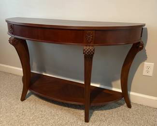 C55 - $75 Demi Lune Entry Table #2. Measures 52" wide x 18" deep x 30.5" tall. 