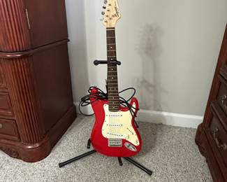 C15 - $100. Squier Mini by Fender with Stand. 