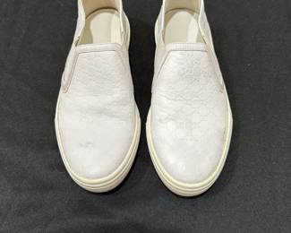 C119 - $125. Size 34.5. Gucci Slip On White Leather Sneakers. Shows minimal wear. 
