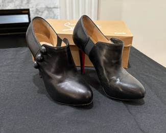 C121 - $225. Christian Louboutin C'est Moi Black Leather Button Ankle Boots with Box. 