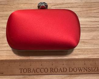C108 - $400*. Alexander McQueen Red Satin Clutch. Very gently used. Beautiful Color!