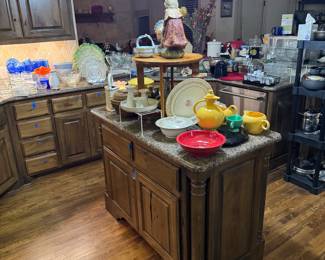 A packed kitchen with everything you need to entertain. Fiesta ware, pots, pans, glassware, utensils.