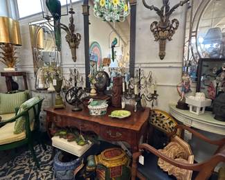 Northern Italian burlwood writing table; Pair of monumental bronze sconces; Painted and parcel gilt arched Neoclassical style mirror; Bustamante style parrot; and more