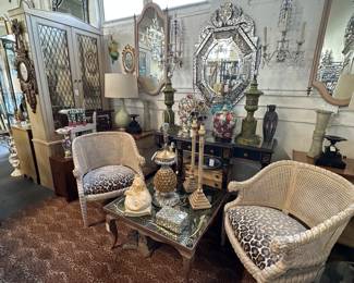 Pair caned barrel form chairs with leopard chenille seats; Mid-century Italian coffee table with eglomise top; Pair of vintage painted Italian mirrors; Octagonal Venetian mirror; Pair of metal buffet lamps on stepped bases, and more
