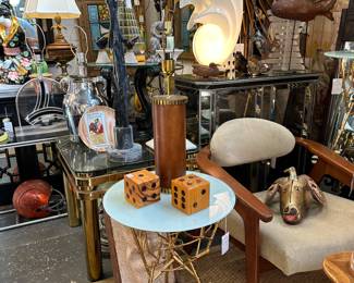 Gold metal arboreal accent table with opaque glass top; Pair Of 1950s teakwood horseshoe armchairs; Vintage mirrored credenza; and more