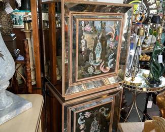 Pair of vintage Italian mirrored cabinets with églomisé doors.