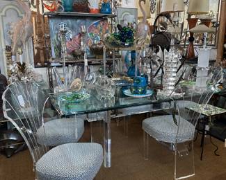 Set of six Lucite dining chairs; Karl Springer tresstle dining table of Lucite, and more