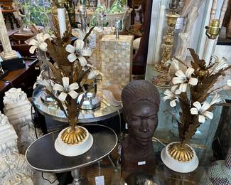 Pair of vintage Italian enamelled and gilded metal floral lamps; Pair of capiz shell clad vintage lamps; Carved bust; Large pair of painted corbels; Paul McCobb style accent table, and more