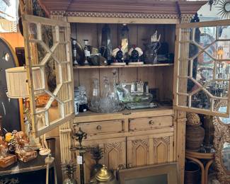 Cabinet with fretwork doors.