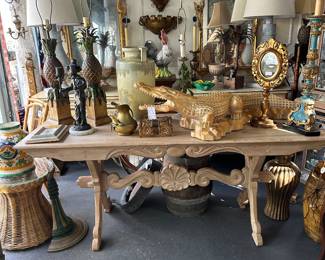 Blonde wood hand-carved tressel table with scalloped shell stretcher; carved wood alligator; and more...
