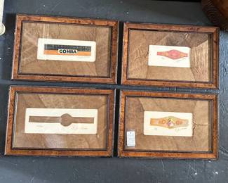 Set of four signed/numbered Charles Leonard cigar band lithos, matted in tobacco leaves and framed.