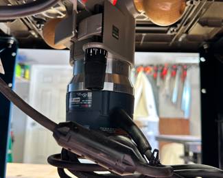 #108 - $160 - Bosch router table # RA1181 with Bosch router attached #1617EVS with wrenches, inserts and feed