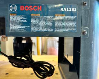 #108 - $160 - Bosch router table # RA1181 with Bosch router attached #1617EVS with wrenches, inserts and feed