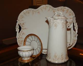 Stunning Limoges Vintage Porcelain 9.5"H Chocolate Pot with Floral Design and Gold Gilt Accents with a Matching Two Handled Tray, 14"W x 12"H and a Rare Antique Meissen "X-Form" Teacup and Saucer. 