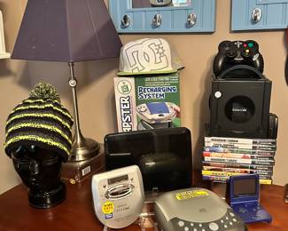 Detailed View of the Technology Available including a Leapster, a Game Cube, Walk Man and More.