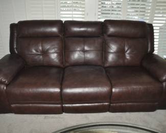 Brown Leather Sofa with Auto Reclining Duel Seats 7'W x 38"D x 36"H. 