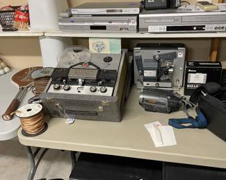 Reel to reel tape deck, 8mm movie projector, assorted VHS, DVD, BluRay and cassette recorders/players.