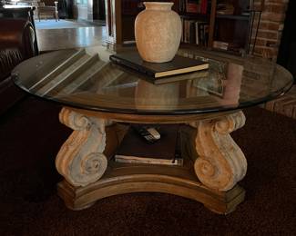 Round glass table with curve stone legs