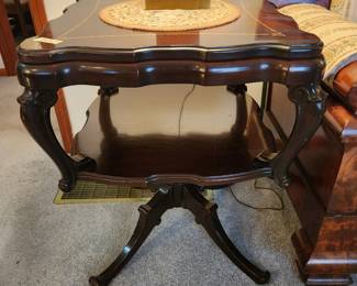 #3	Antique Dark Wood Double Shelf End Table on pedestal Leg - 23x23x28 (few watermarks) w/gold Decal on top	 $225.00 
