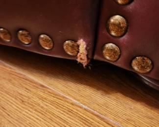 #55	Burgundy Pleather Sofa w/brass nail head Trim - 88x37x36" Long (one small tear)	 $300.00 
