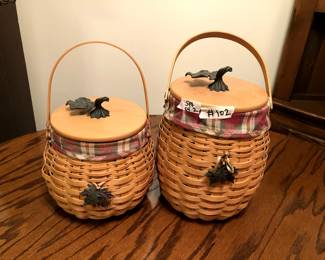 #102	Set of Two Longaberger Baskets w/Lid and Single Handle w/Metal Leaf Emblem Top and Front 	 $40.00 
