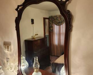 #48	Wood Framed Oval Top Carved Mirror - 29x45 - small crack in Frame	 $75.00 

