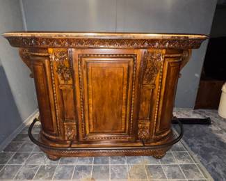 Beautiful ornate solid wood dry bar with granite bar top. 