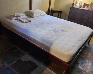 Queen platform bed. Dark wood