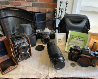 Asahi Pentax MX 35mm w/Pentax 1:1.8/55mm lens, original case; Tokyo Kogaku Primo-JR 4x4 Twin lens Reflex Camera in original case; Sakar Macro Zoom lens 70-210mm; Yashica FX 35mm SLR. All untested.