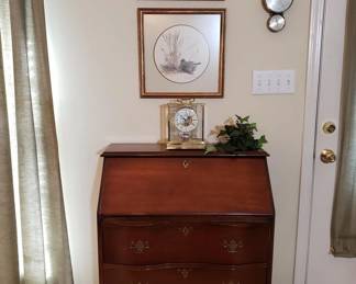 Seth Thomas clock on a cherry chest/writing desk