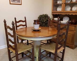 Round pedestal dining table and four ladder back chairs