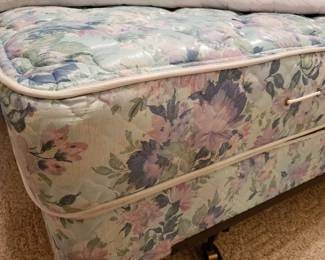 A close look at the queen-size bed's mattress and foundation