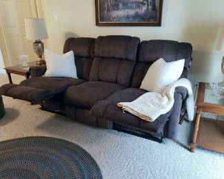 The sofa's recliners with the foot rests raised