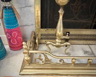 Brass fireplace bumper, andirons, and tools