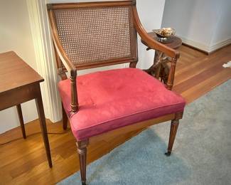 One of two vintage mid-century caned chair 