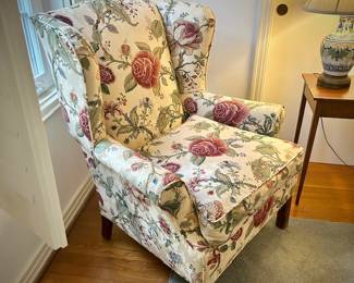 Second of two floral custom-upholstered wingback chairs