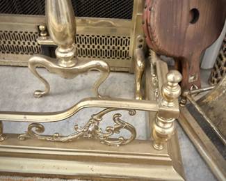 Brass fireplace bumper, andirons, and tools