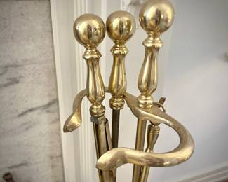 Brass fireplace bumper, andirons, and tools