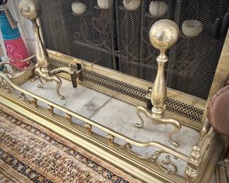 Brass fireplace bumper, andirons, and tools