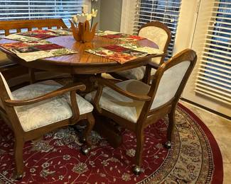 Antique oak table, 6 ladder back chairs, 5 rolling chairs if desired, matching lazy susan