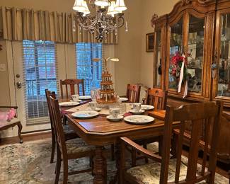 Beautiful antique dining table and matching chairs with leaf.  Very sturdy.  
