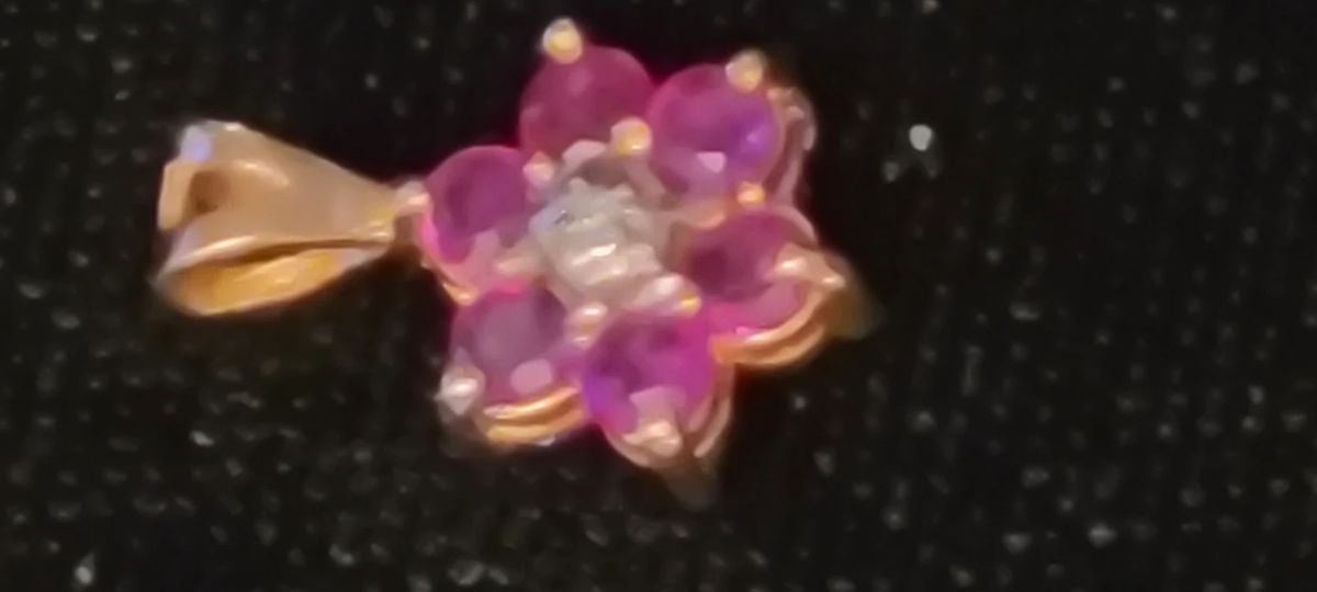 Unique 14K  Ruby pendant. Turn it over and you will find Sapphires as shown in the next picture. 