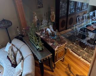 Silver and black table $300, lite table and chairs in the far right upper corner $4000