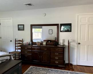Elegant cherrywood dresser and mirror, lots of drawers, the middle cabinets open with sliding drawers and soft close.