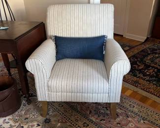 Gray pin striped upholstered chair (with matching ottoman not pictured).